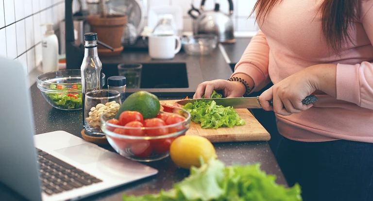woman cutting vegetables